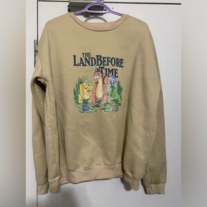 The Land Before Time Crewneck Sweater L/XL
Beige Dinosaur 1988 Movie